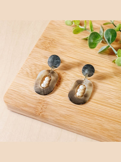 JewelryBlack Mother of Pearl Dangle Earrings - Oval with Inner Pearl | LIKHÂLIKHÂ